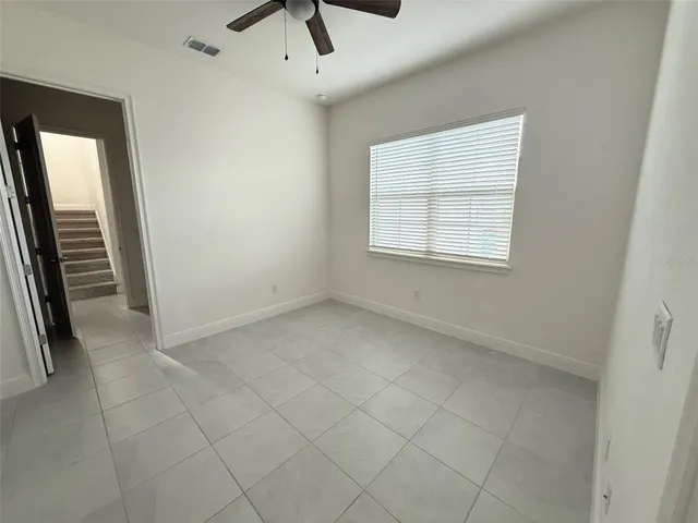 a bathroom with a double vanity sink toilet and mirror
