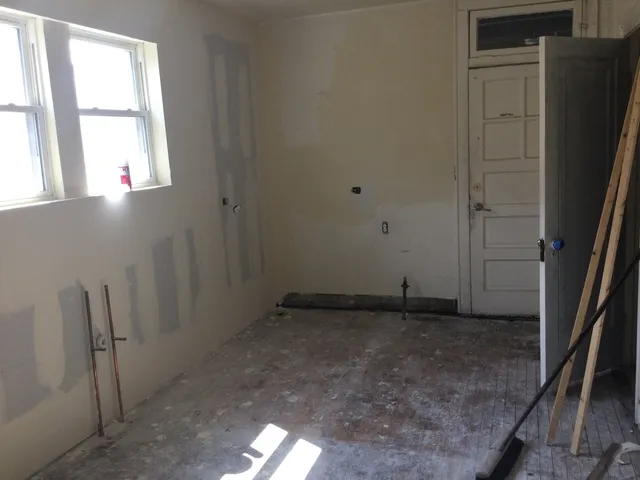 a view of an empty room and window