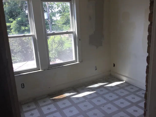 a view of a livingroom with furniture wooden floor and a window