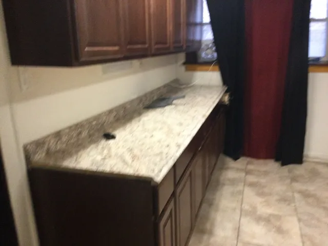 a kitchen with a sink and cabinets