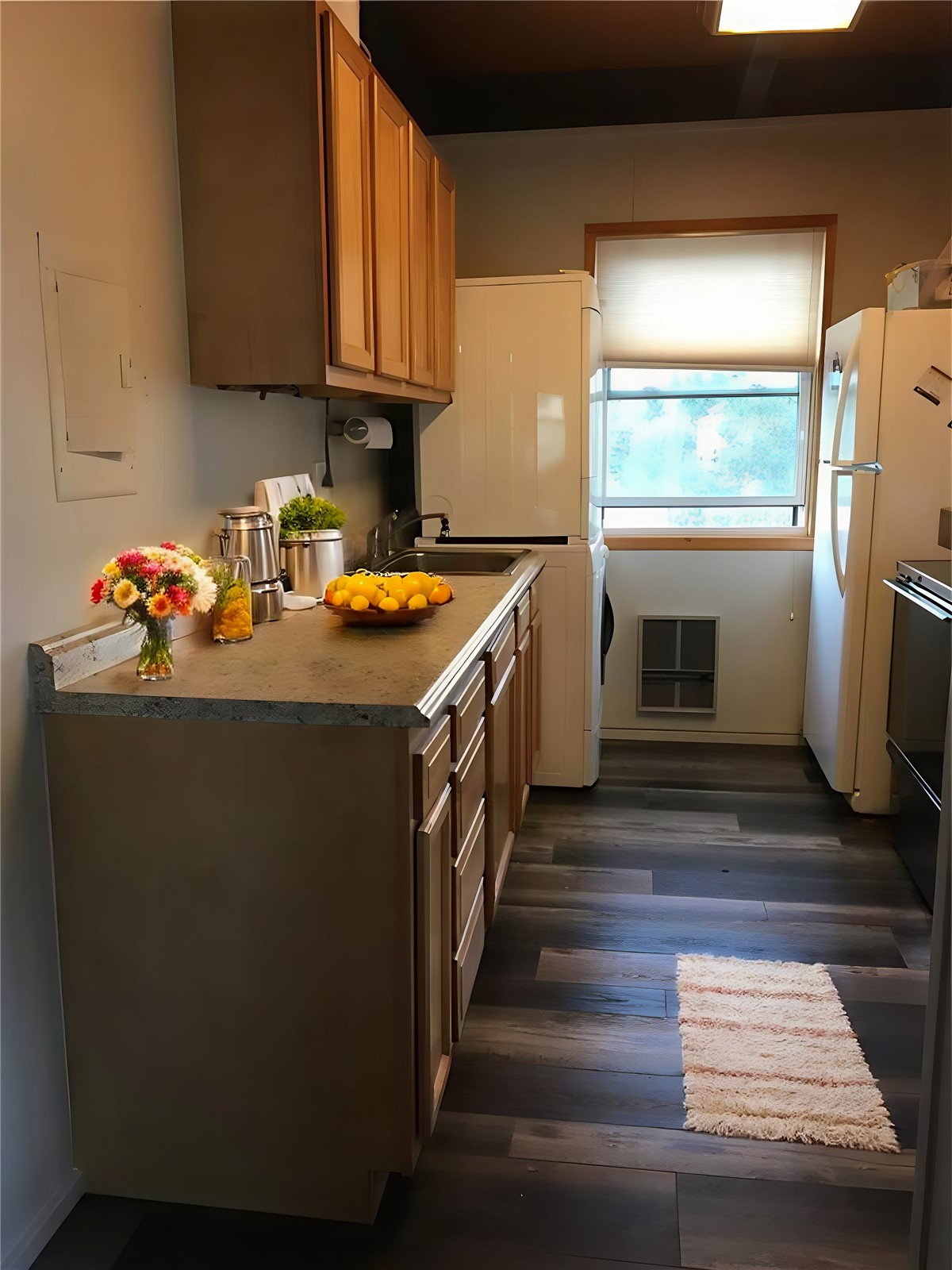 8017 Ryan Gulch Road, Unit B8 Silverthorne, CO 80498 - Photo 9 of 15 VIRTUAL STAGING Kitchen featuring white refrigerator, sink, and dark hardwood / wood-style flooring