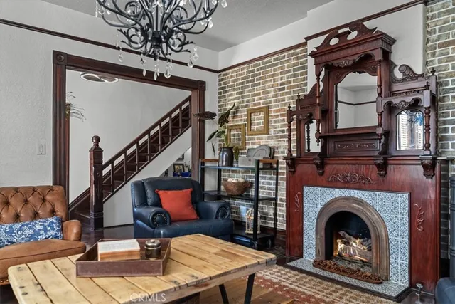 a kitchen with stainless steel appliances a sink a stove cabinets and a dining table