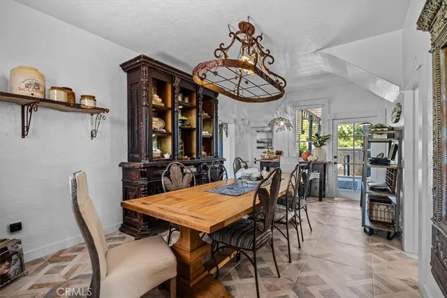 a large bedroom with a bed a large window and furniture