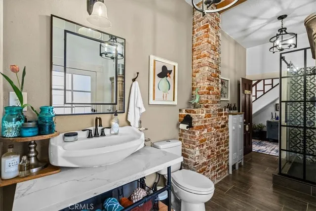 a bedroom with furniture and large windows