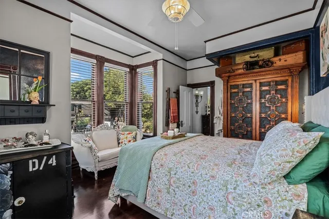 a dining room with furniture window and wooden floor