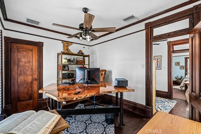 a table and chairs under an umbrella in front of house