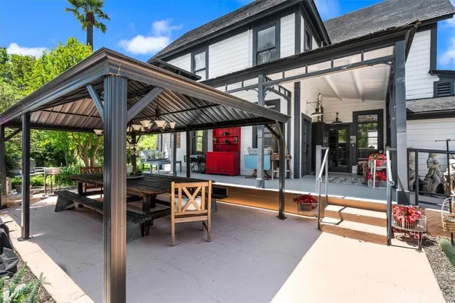 a kitchen with stainless steel appliances granite countertop a stove and a refrigerator