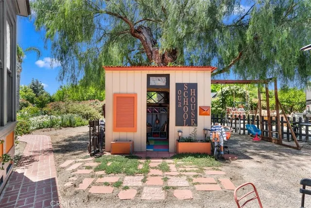 a living room with furniture a rug and a table