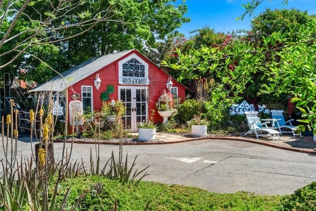 a kitchen with stainless steel appliances a sink refrigerator and cabinets