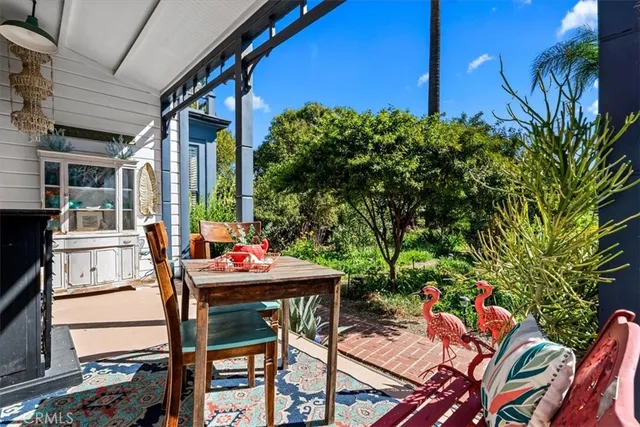 a living room with furniture or couch and a chandelier