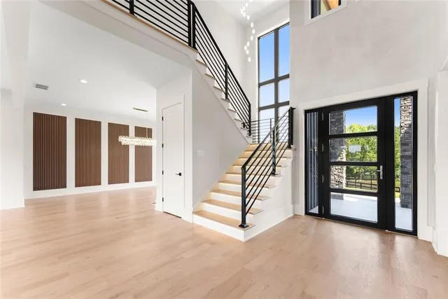 a view of entryway and hall with wooden floor