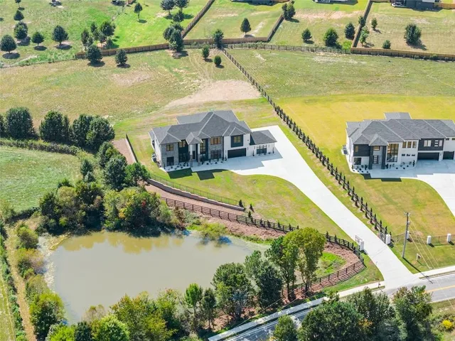 a view of a pathway with a wrought fence