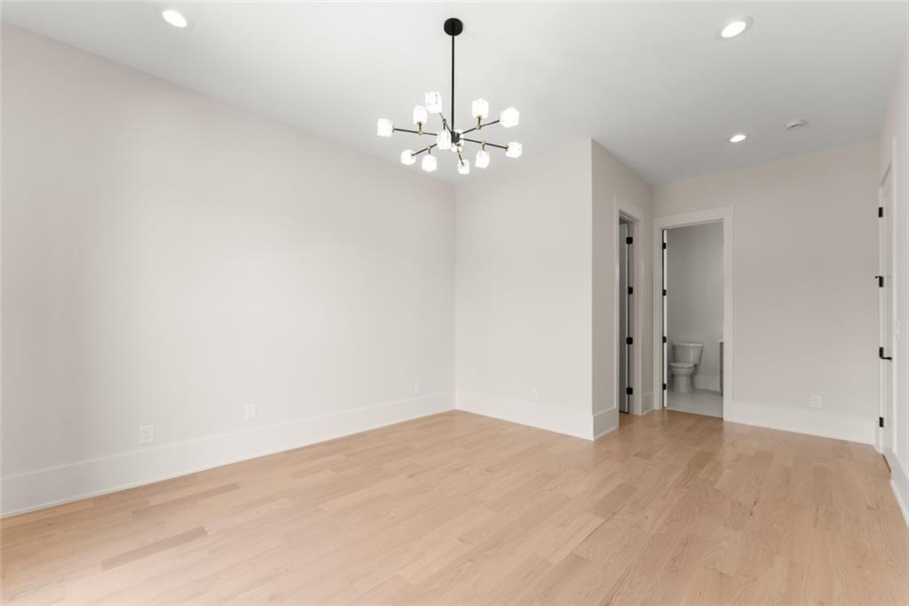 2031 Jones Phillips Road Dacula, GA 30019 - Photo 29 of 89 a view of an empty room with chandelier fan