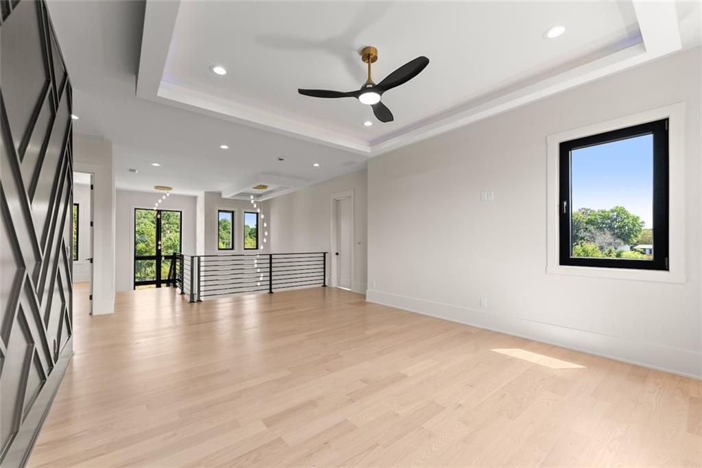 2031 Jones Phillips Road Dacula, GA 30019 - Photo 35 of 89 an empty room with wooden floor and windows