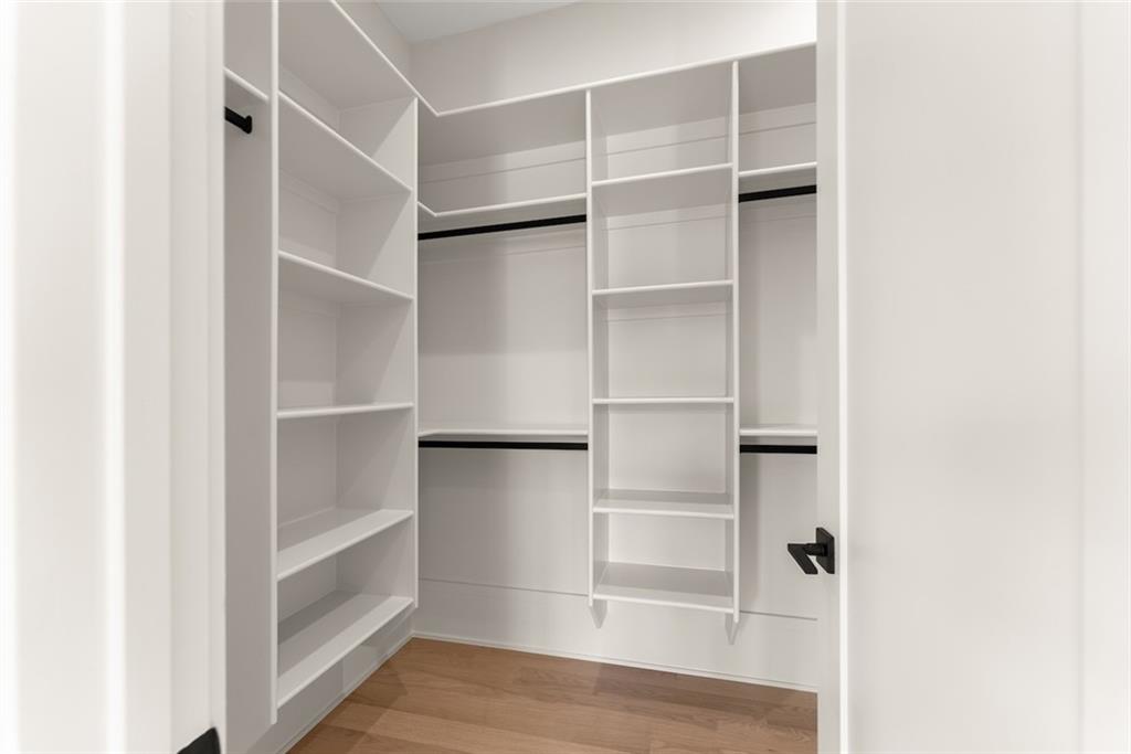 2031 Jones Phillips Road Dacula, GA 30019 - Photo 40 of 89 a view of walk in closet with empty racks