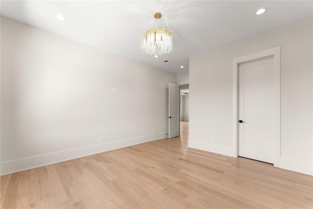 2031 Jones Phillips Road Dacula, GA 30019 - Photo 43 of 89 a view of an empty room with wooden floor