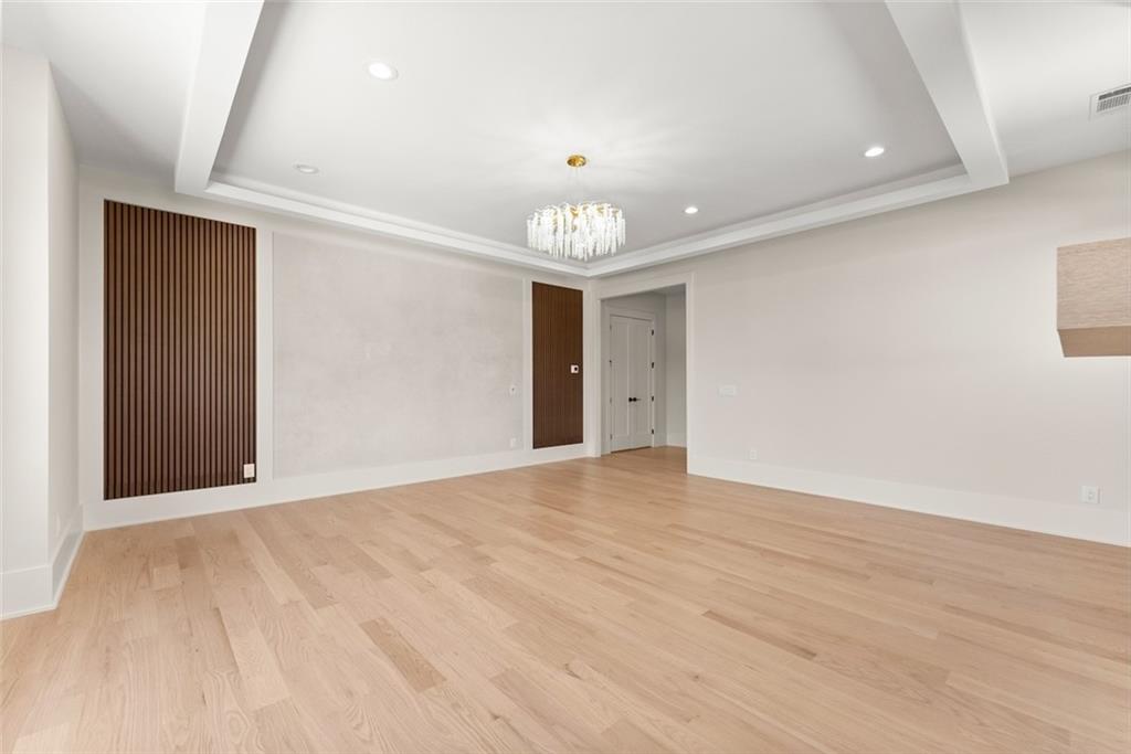 2031 Jones Phillips Road Dacula, GA 30019 - Photo 46 of 89 a view of an empty room with wooden floor