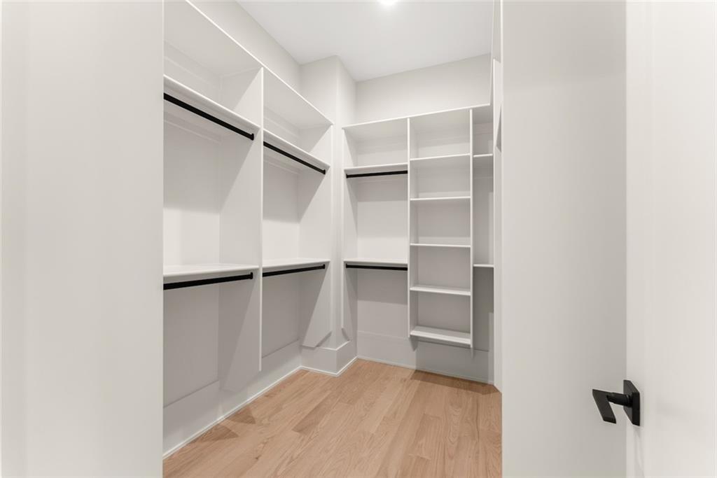 2031 Jones Phillips Road Dacula, GA 30019 - Photo 47 of 89 a view of walk in closet with empty racks