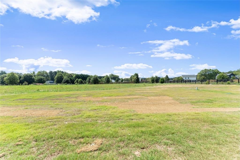 2031 Jones Phillips Road Dacula, GA 30019 - Photo 57 of 89 a view of a lake with a big yard