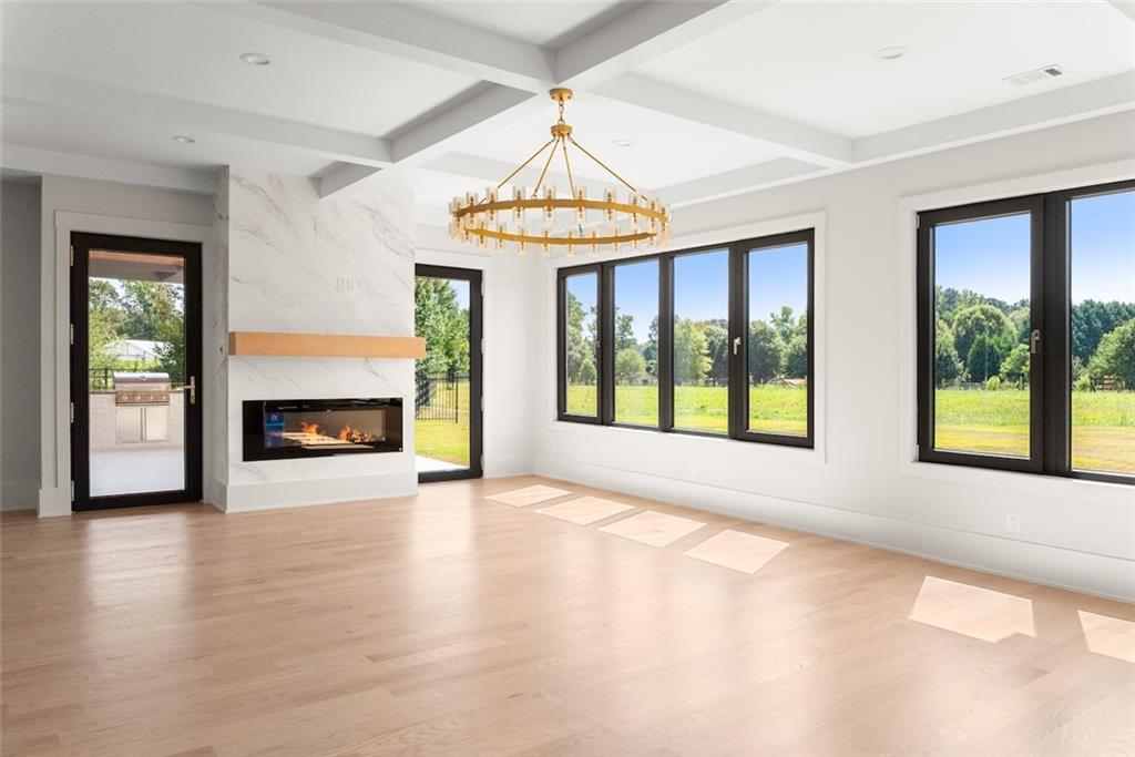 2031 Jones Phillips Road Dacula, GA 30019 - Photo 60 of 89 a view of an empty room with window and fire place