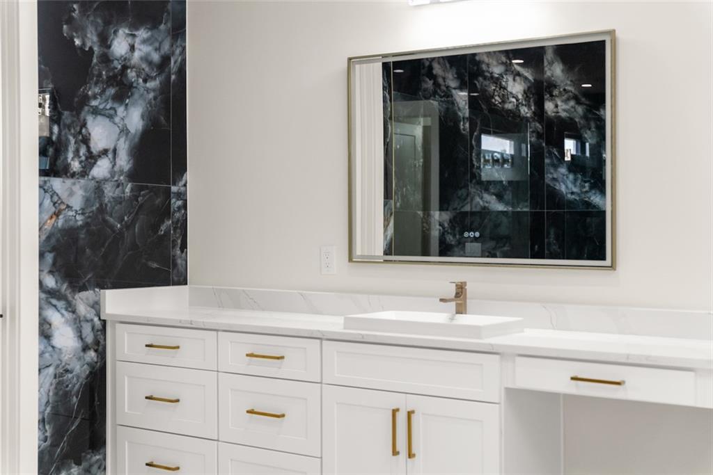 2031 Jones Phillips Road Dacula, GA 30019 - Photo 65 of 89 a view of a sink and mirror