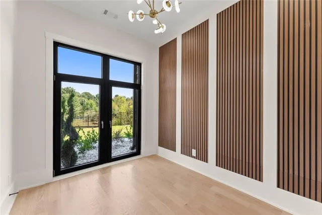 a kitchen with stainless steel appliances granite countertop a sink a stove and a refrigerator