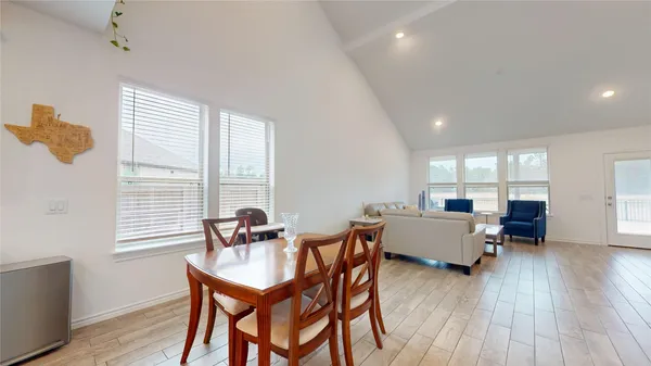 a dining room with furniture and window