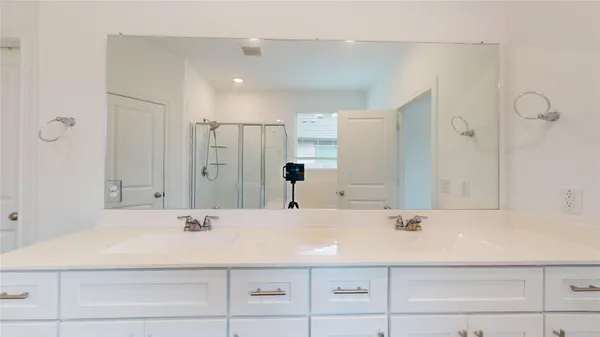 a bathroom with a shower and a bath tub