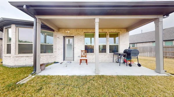 a house with swimming pool in front of it