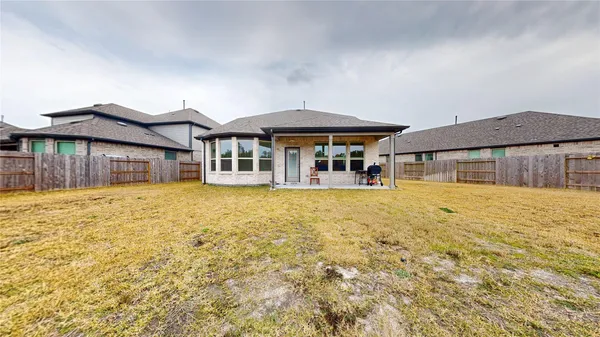 an aerial view of a house with a ocean view