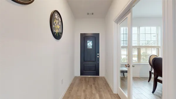 a view of a livingroom with furniture and windows
