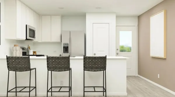 a kitchen with stainless steel appliances a stove top oven a sink a microwave and a refrigerator
