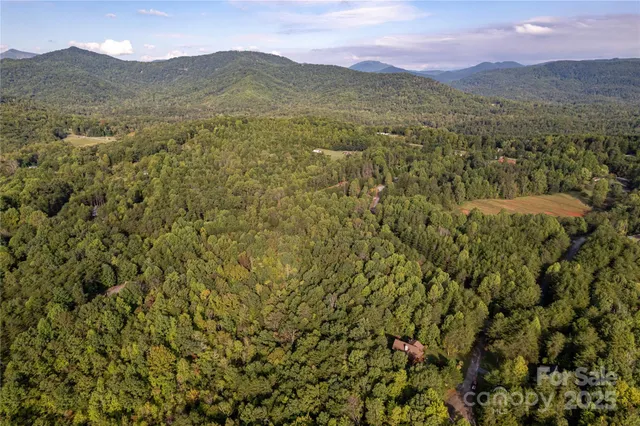 a view of a town with mountains in the background
