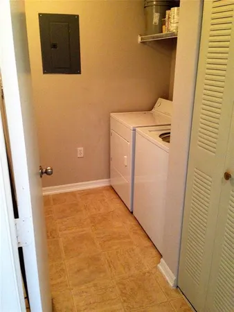 a bathroom with a granite countertop shower and a sink