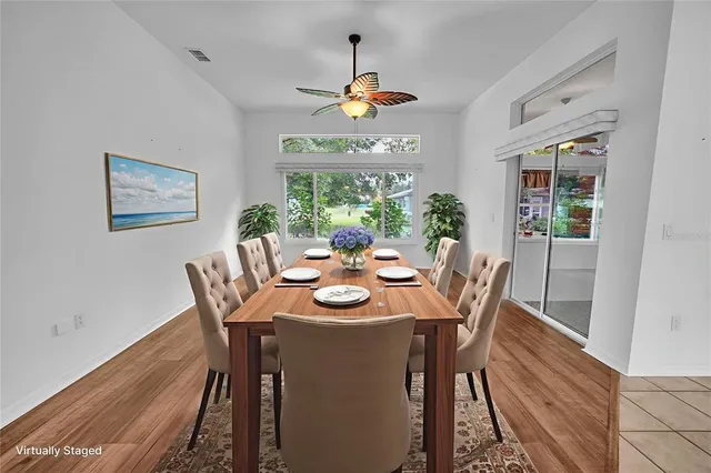 a dining room with furniture a window and a rug