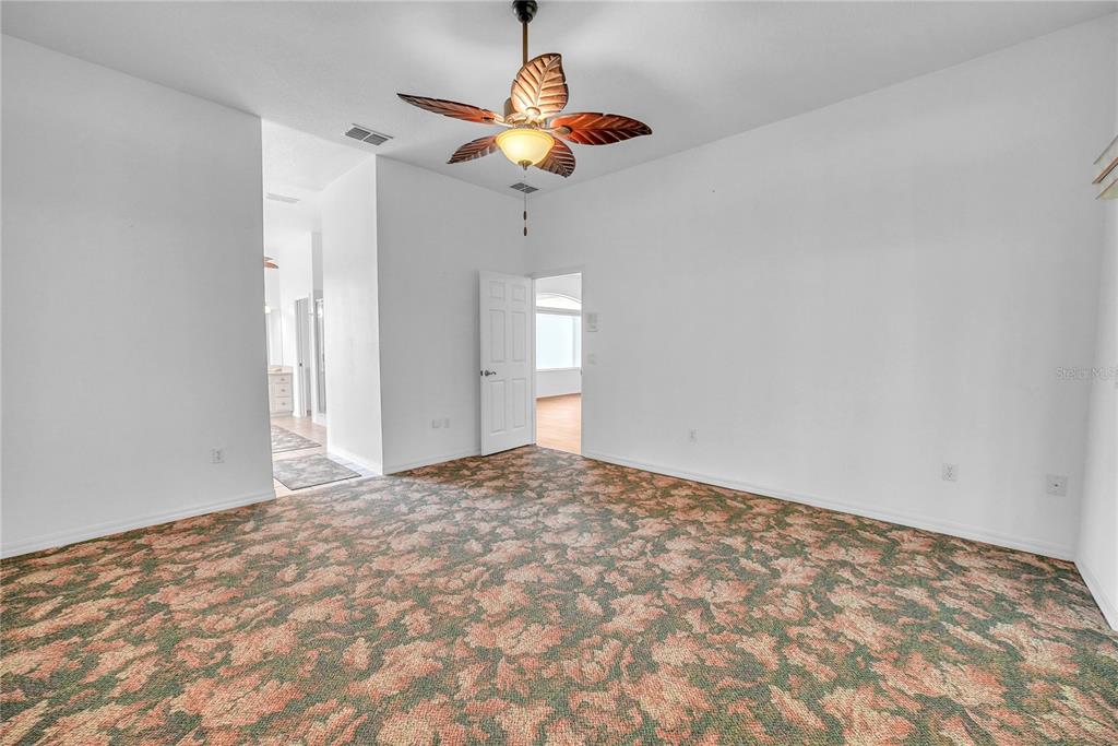 10317 Southwest 63rd Avenue Ocala, FL 34476 - Photo 18 of 46 a view of empty room with wooden floor