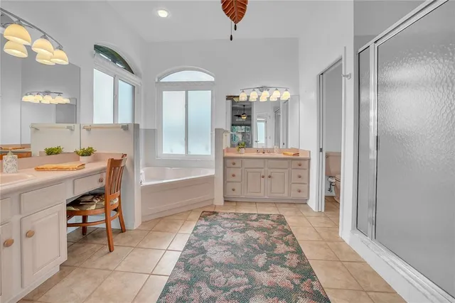 a bathroom with a sink a vanity and a mirror
