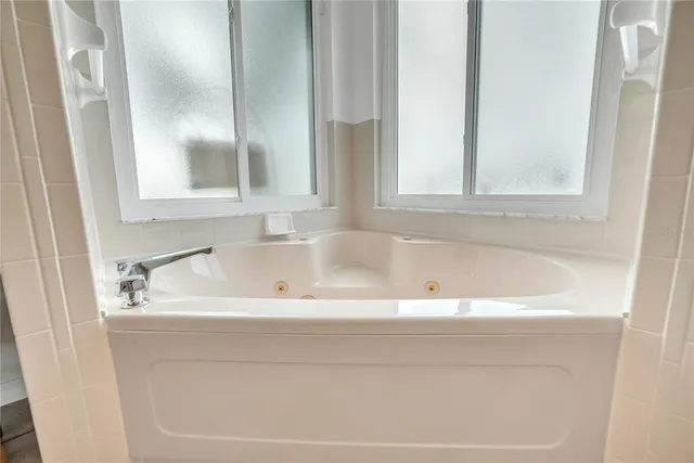 a close view of a bathtub in bathroom