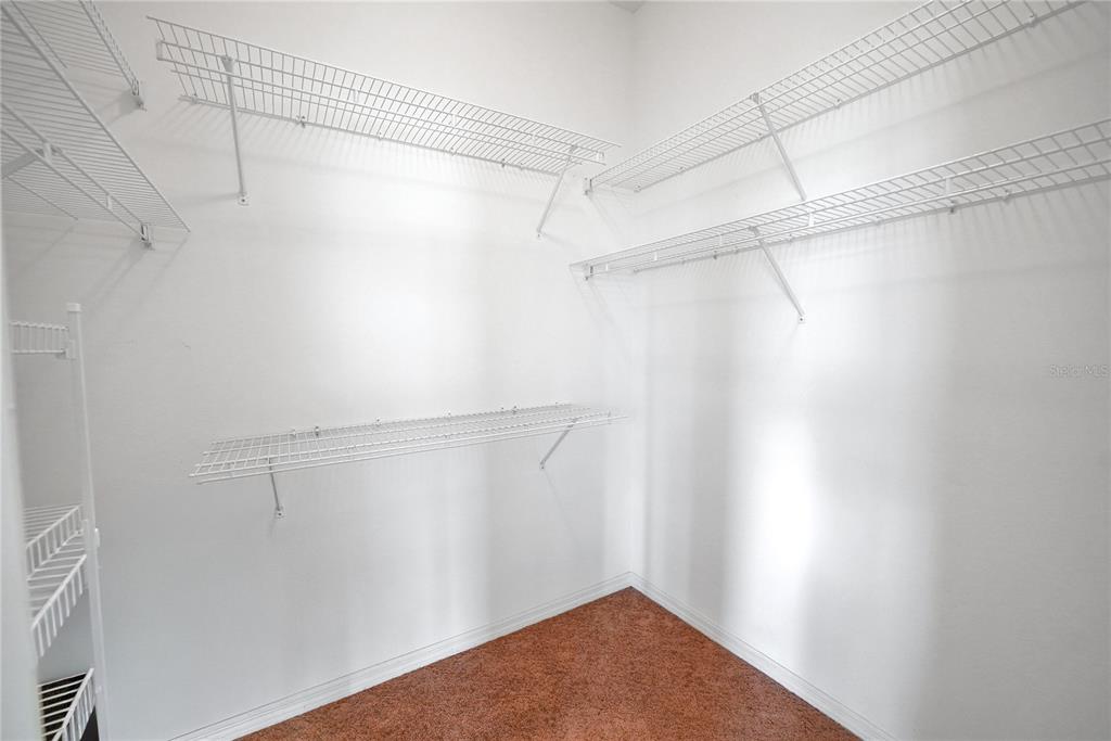 10317 Southwest 63rd Avenue Ocala, FL 34476 - Photo 24 of 46 a view of a room with racks on the wall