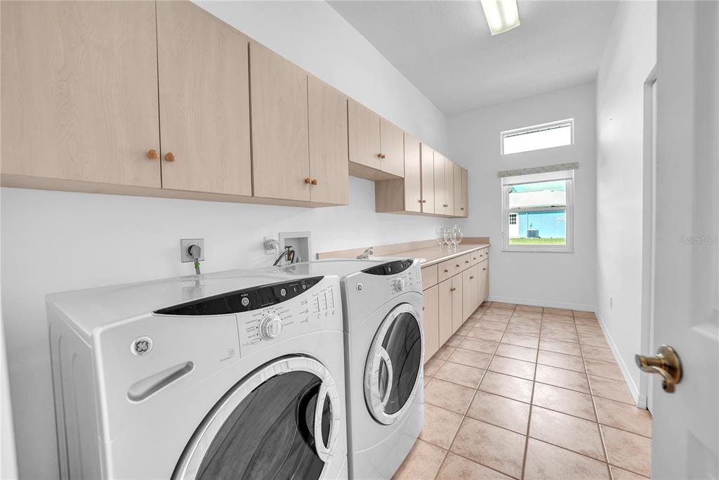 10317 Southwest 63rd Avenue Ocala, FL 34476 - Photo 31 of 46 a utility room with dryer and washer