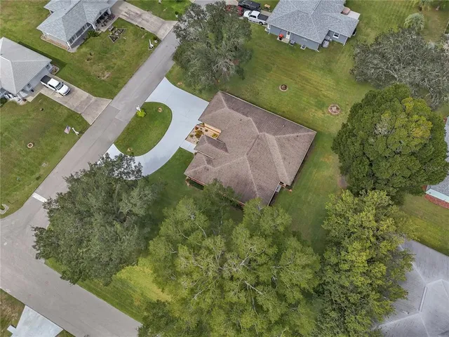 an aerial view of a house with a swimming pool