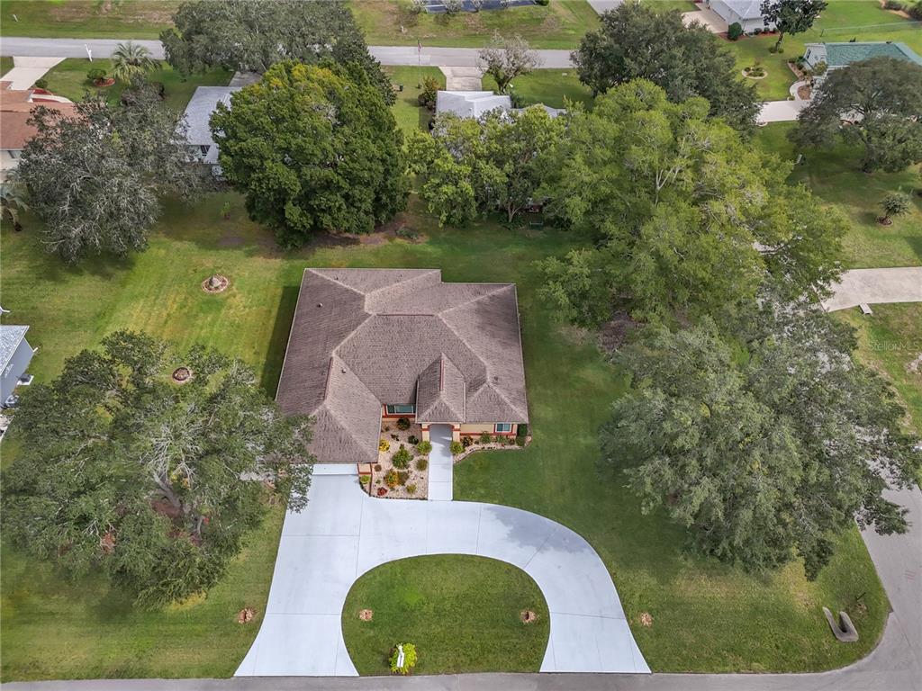10317 Southwest 63rd Avenue Ocala, FL 34476 - Photo 46 of 46 an aerial view of a house with outdoor space and a lake view