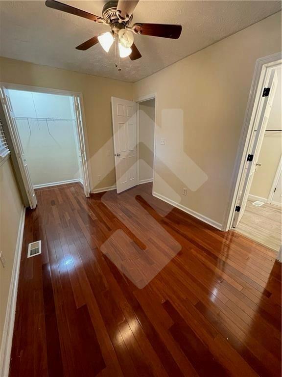 4267 Grogan Street Acworth, GA 30101 - Photo 28 of 37 a view of an empty room with wooden floor