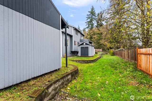 a house view with a backyard space