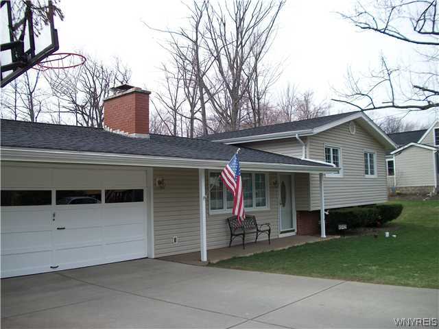 4942 Milestrip Road Hamburg, NY 14219 - Photo 1 of 1 Exterior Front. Sprawling split level with 2 car a