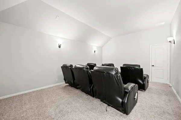 a living room with furniture and a air conditioner vent