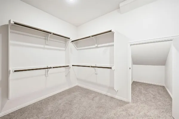 a view of an empty walk in closet