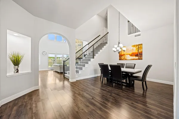a view of a dining room with furniture and wooden floor