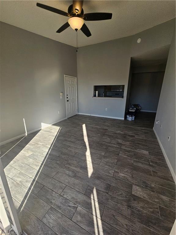 1200 Reserve Way, Unit 302 Naples, FL 34105 - Photo 3 of 15 a bedroom with a bed and a chandelier