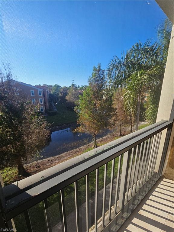 1200 Reserve Way, Unit 302 Naples, FL 34105 - Photo 4 of 15 a view of a balcony with wooden fence and floor